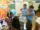 spiritchild working with children in a classoom with a laptop and microphone